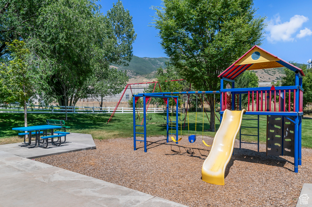 Communal playground featuring a mountain view