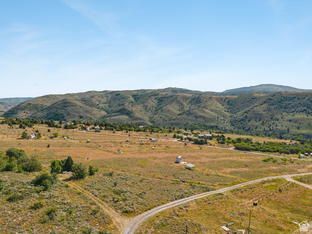 View of mountain backdrop with rural landscape