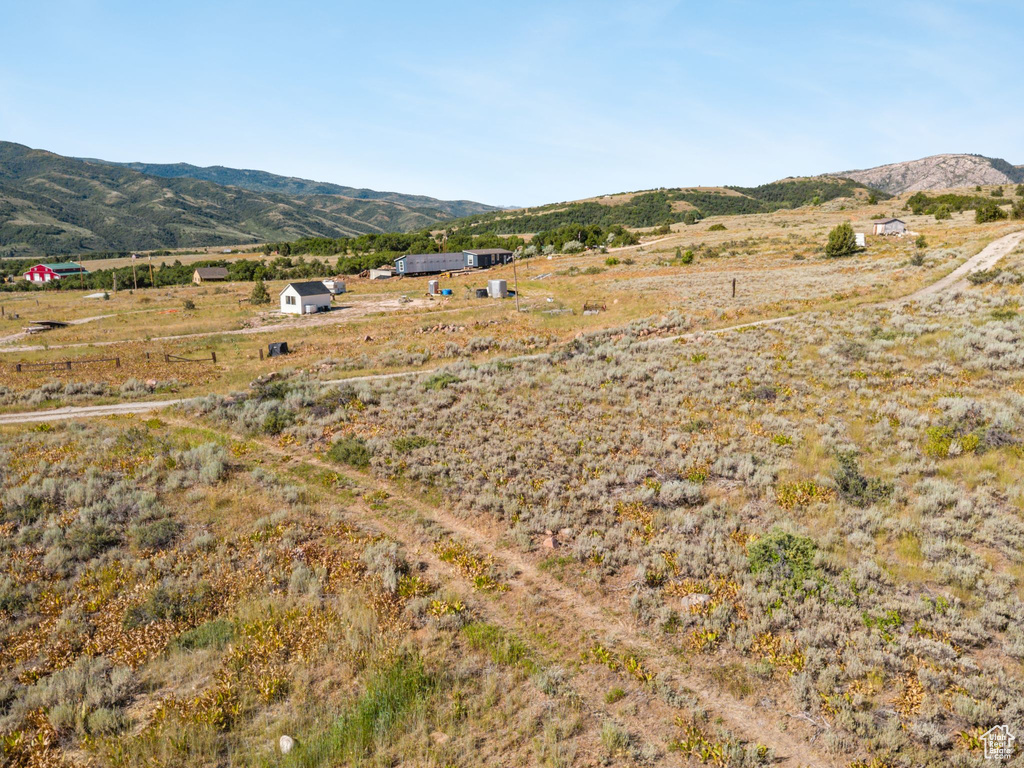 View of mountain background featuring rural landscape