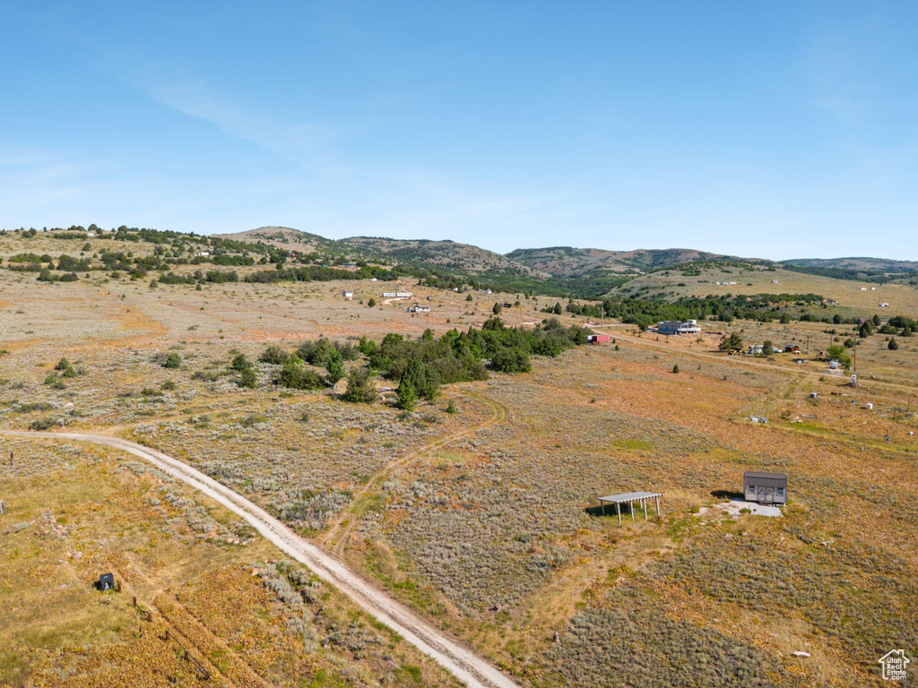 Overview of rural landscape featuring a mountain backdrop