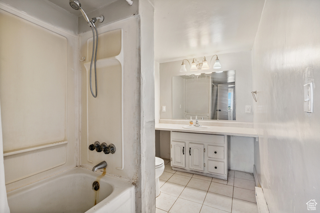 Full bath with tile patterned floors, vanity, and bathtub / shower combination