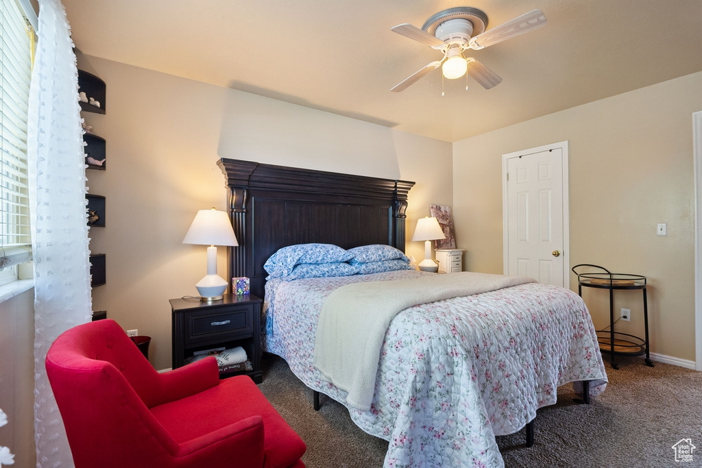 Bedroom with carpet and a ceiling fan