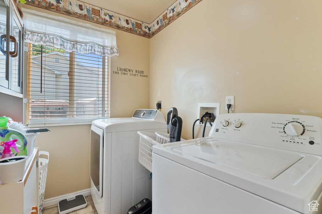 Washroom featuring washer and dryer