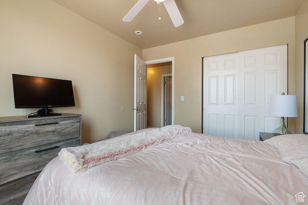 Bedroom with a closet and a ceiling fan