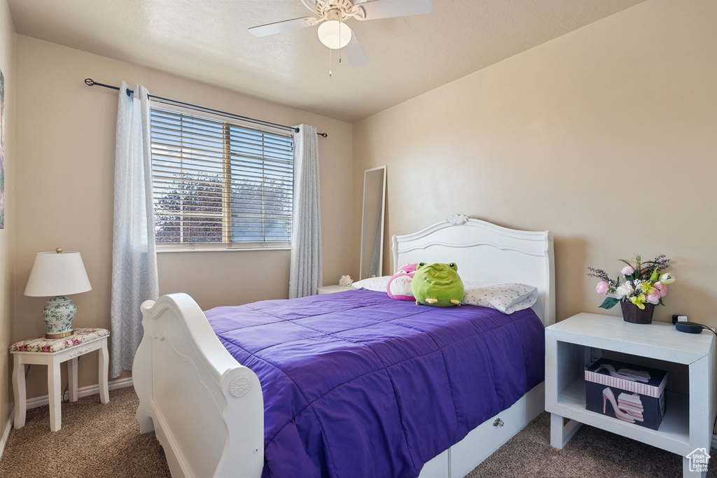 Bedroom featuring carpet flooring and a ceiling fan