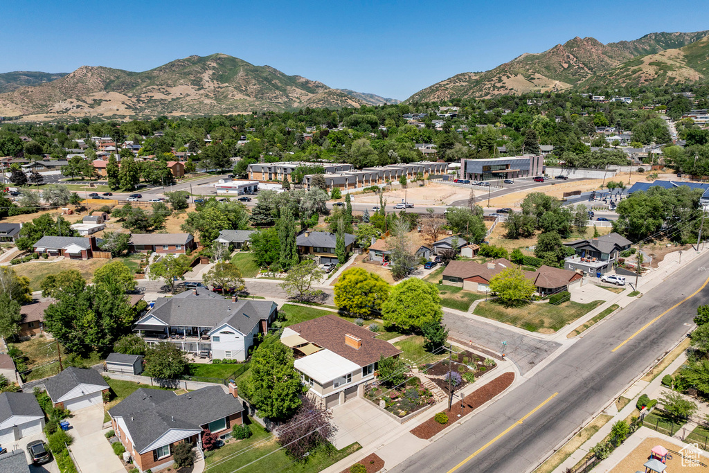 Aerial perspective of suburban area with a mountain backdrop