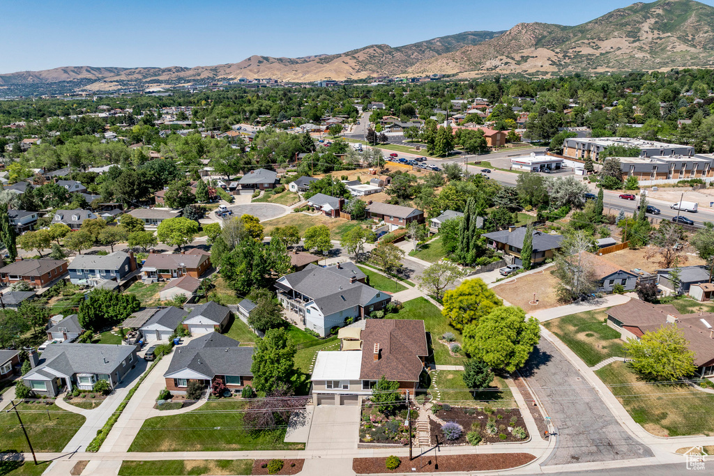 Aerial perspective of suburban area with a mountain backdrop
