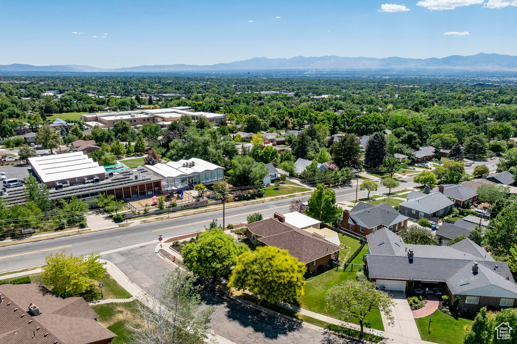 Aerial perspective of suburban area featuring a mountainous background