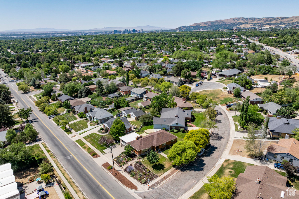 Aerial view of residential area featuring a mountainous background