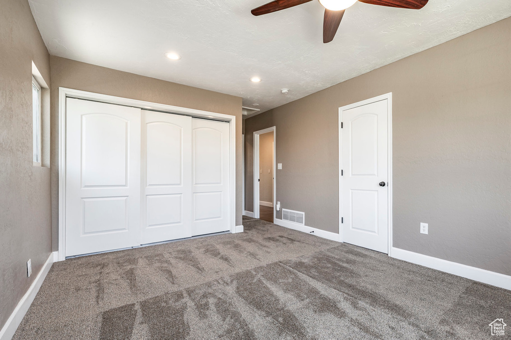 Unfurnished bedroom with a closet, carpet flooring, a ceiling fan, and recessed lighting