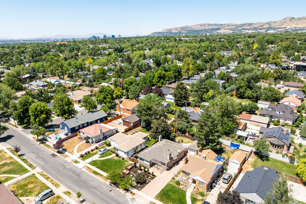 Aerial view of residential area featuring a mountainous background