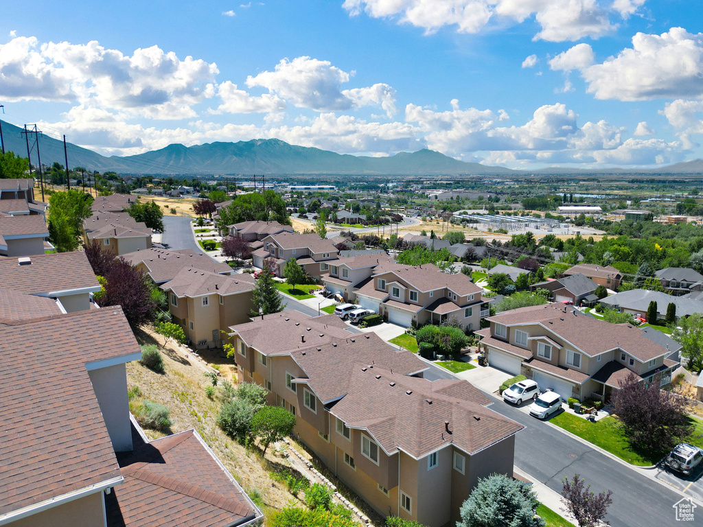 Aerial view of residential area featuring a mountain backdrop