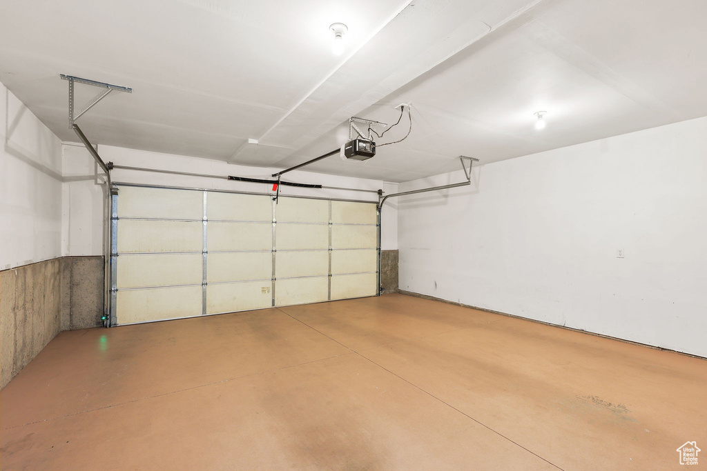 Garage featuring a garage door opener