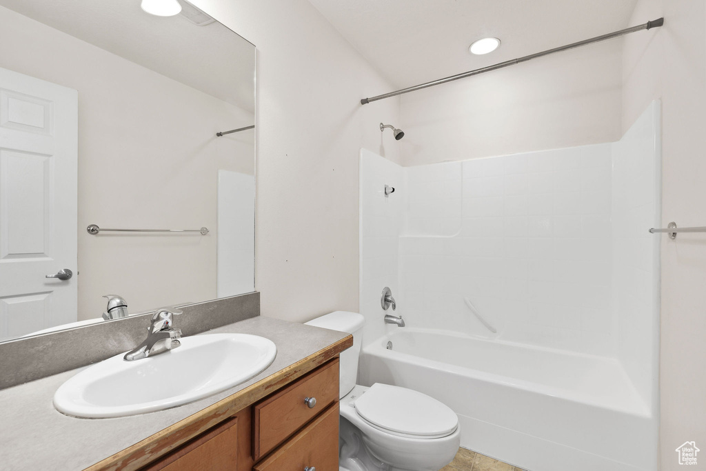 Bathroom featuring vanity and shower / washtub combination