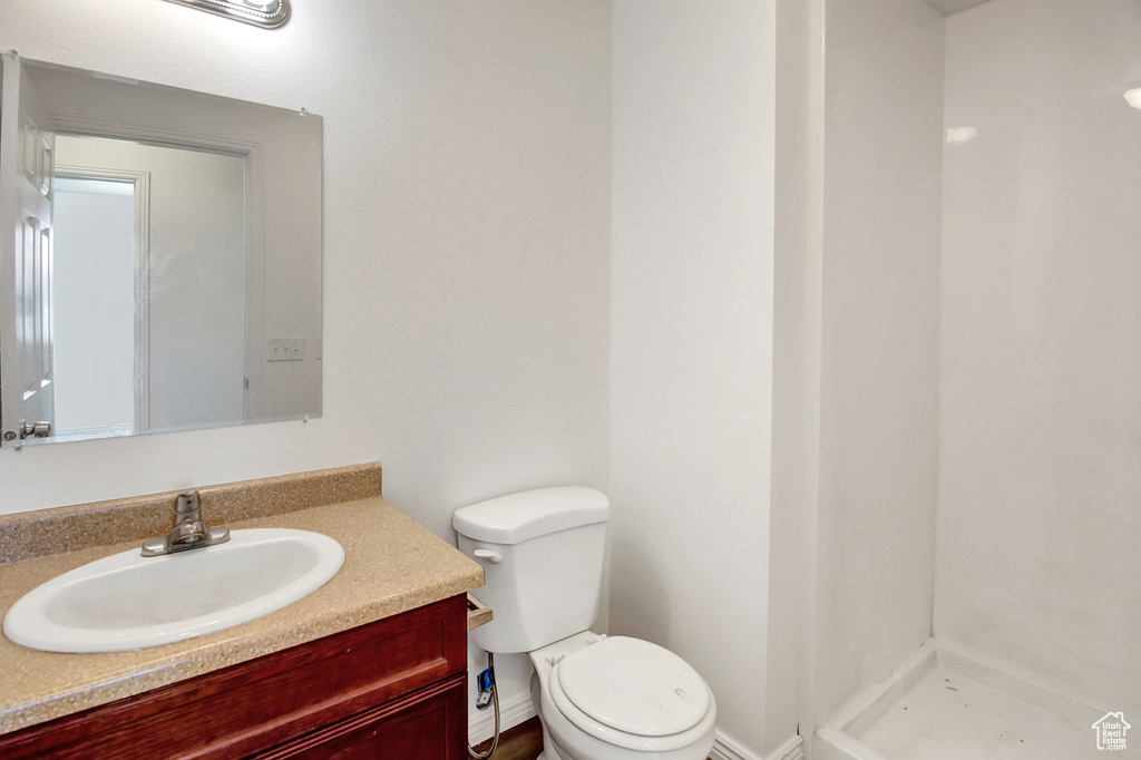 Bathroom with vanity and a shower stall