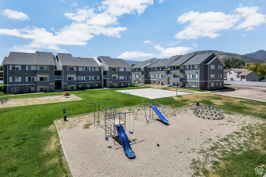 View of community featuring a residential view and a yard