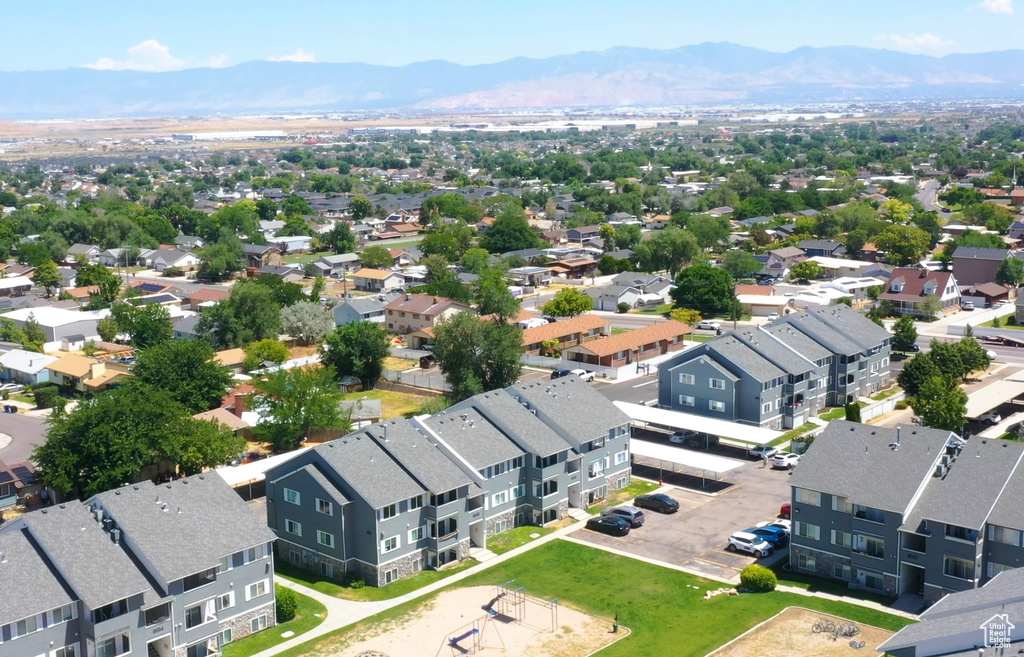 Aerial perspective of suburban area featuring a mountain backdrop