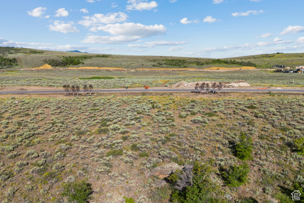 View of yard with a rural view