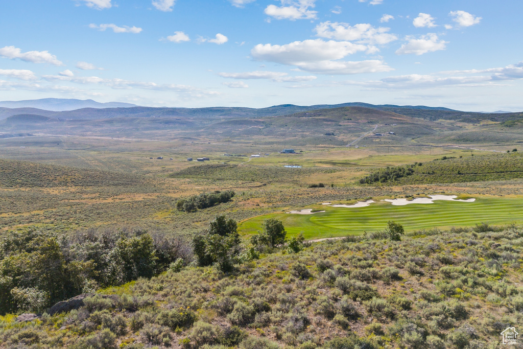 View of mountain backdrop with a golf course