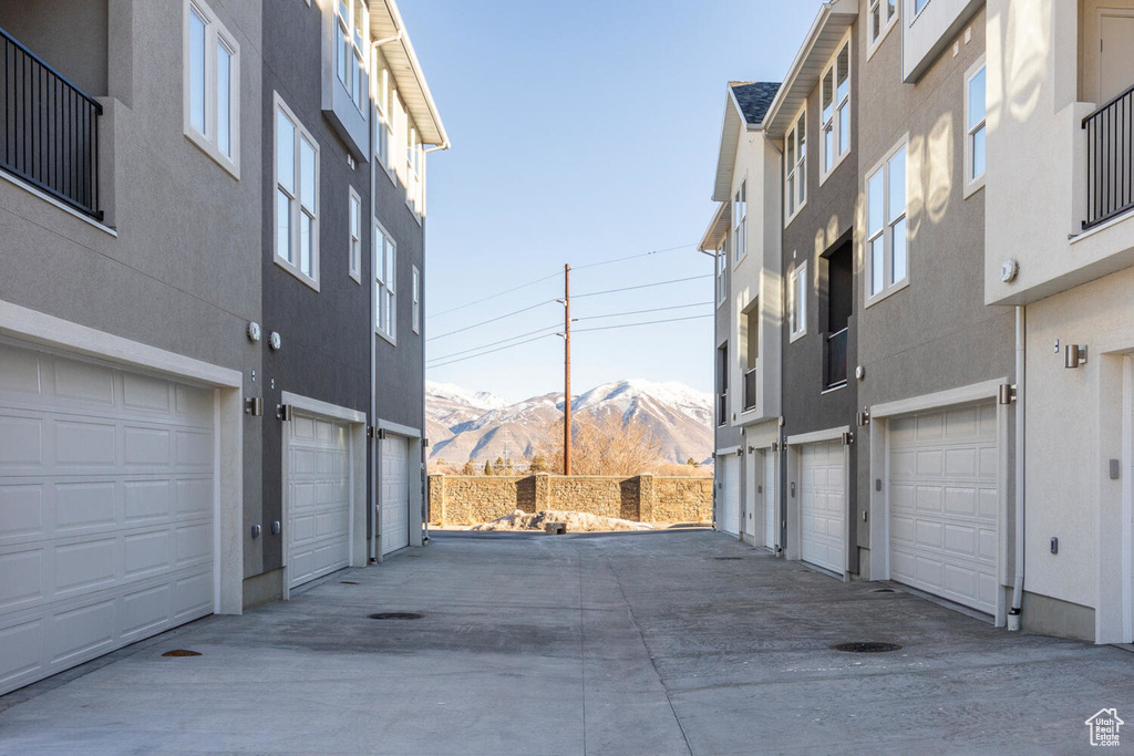 Garage with a mountain view and driveway
