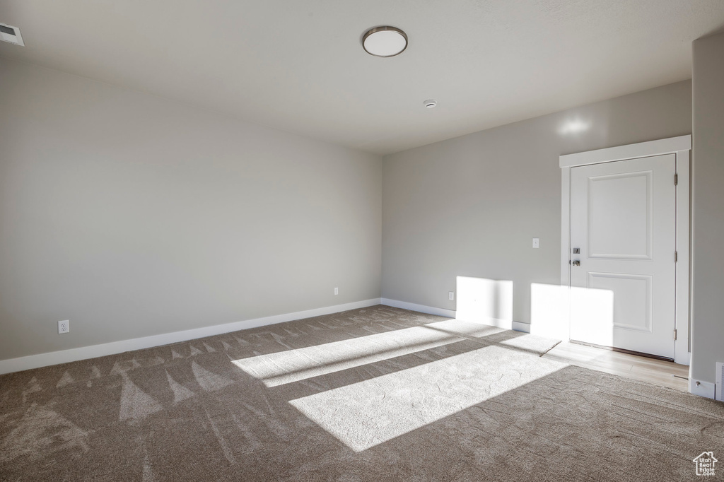 Unfurnished room featuring carpet floors