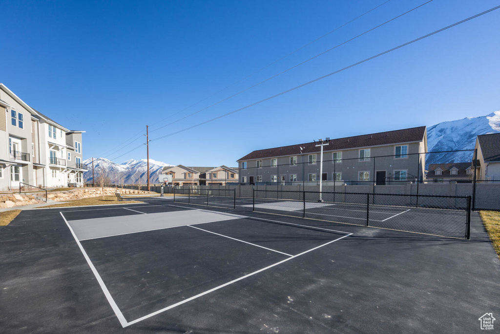View of tennis court featuring a mountain view