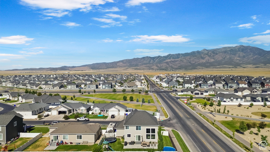 Aerial perspective of suburban area featuring a mountain backdrop