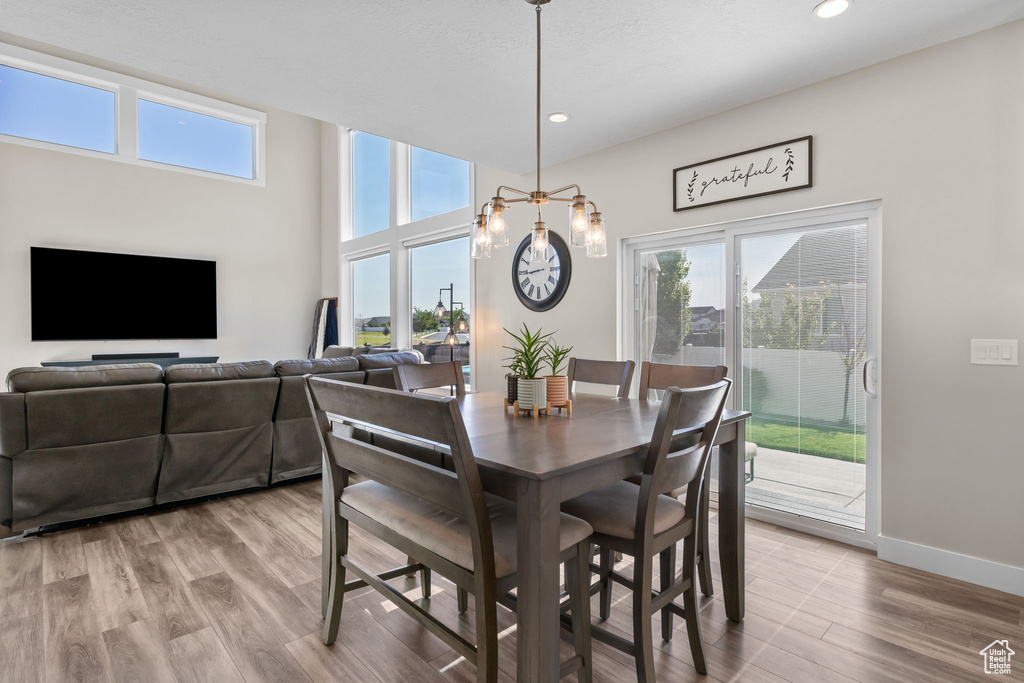 Dining space featuring a chandelier, recessed lighting, and light wood-type flooring