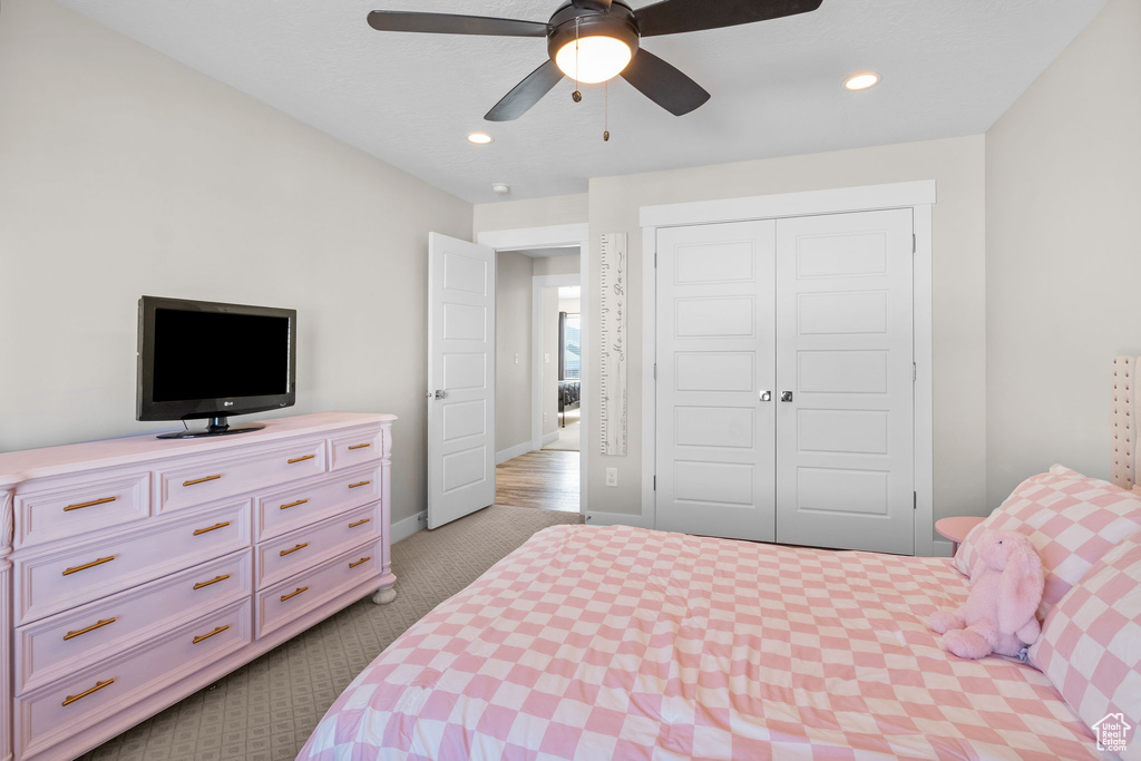 Bedroom with carpet flooring, a closet, recessed lighting, and ceiling fan