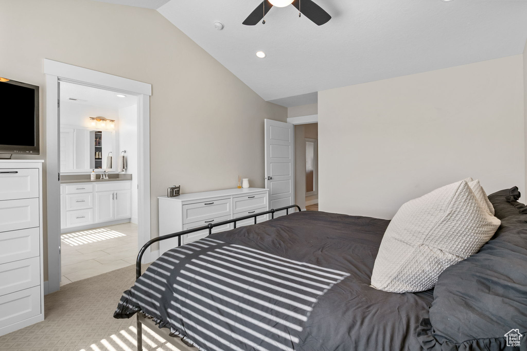 Bedroom featuring lofted ceiling, connected bathroom, a ceiling fan, and recessed lighting