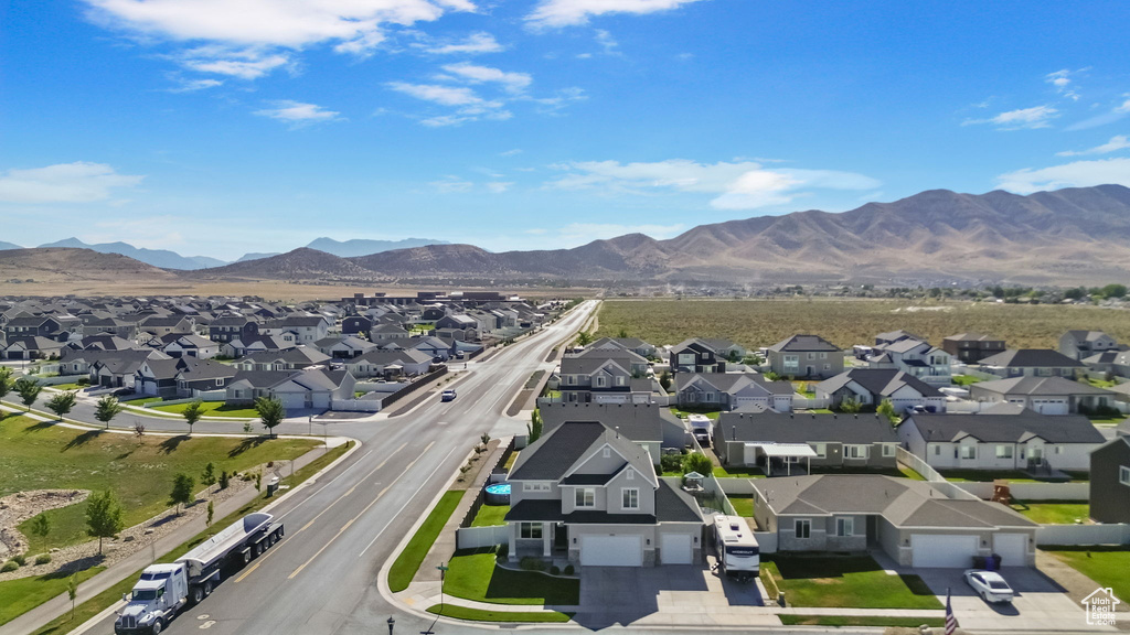 Aerial perspective of suburban area with a mountain backdrop
