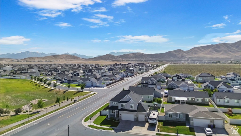 Aerial view of residential area featuring a mountainous background