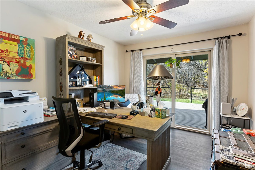 Office featuring wood finished floors, ceiling fan, and a textured ceiling