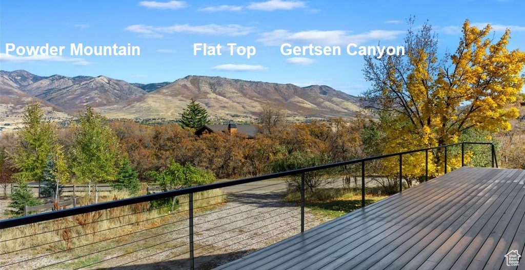 Wooden deck featuring a mountain view