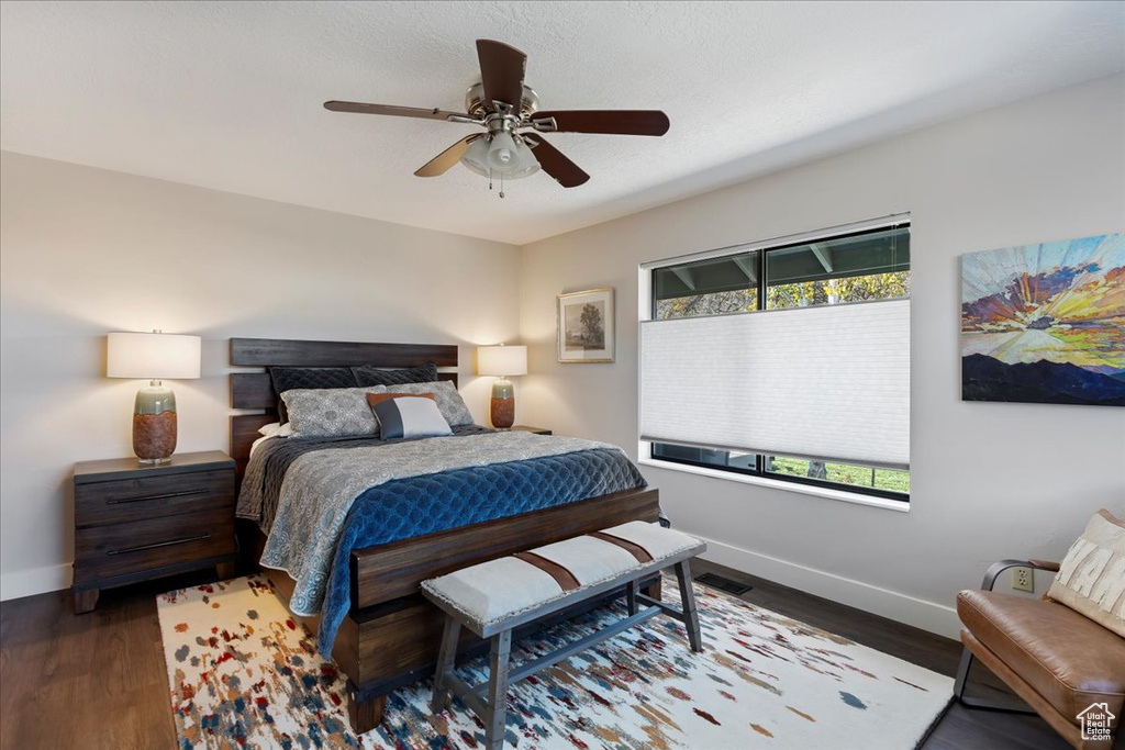 Bedroom with wood finished floors and ceiling fan
