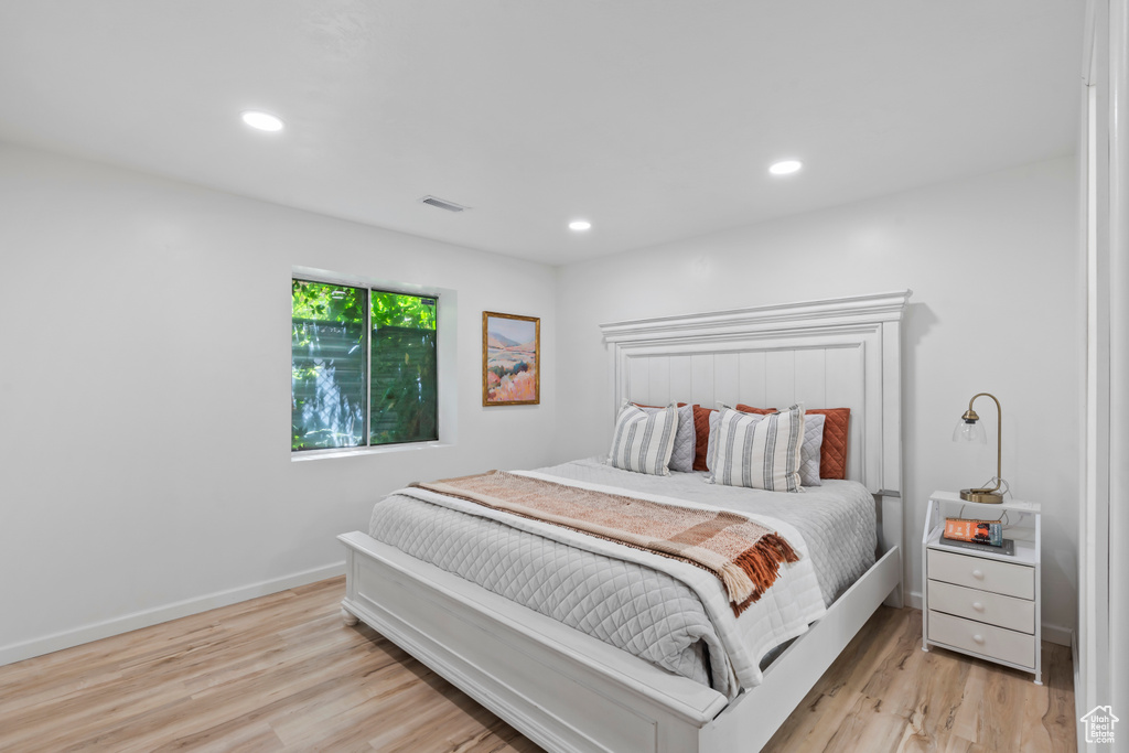Bedroom featuring light wood-style flooring and recessed lighting