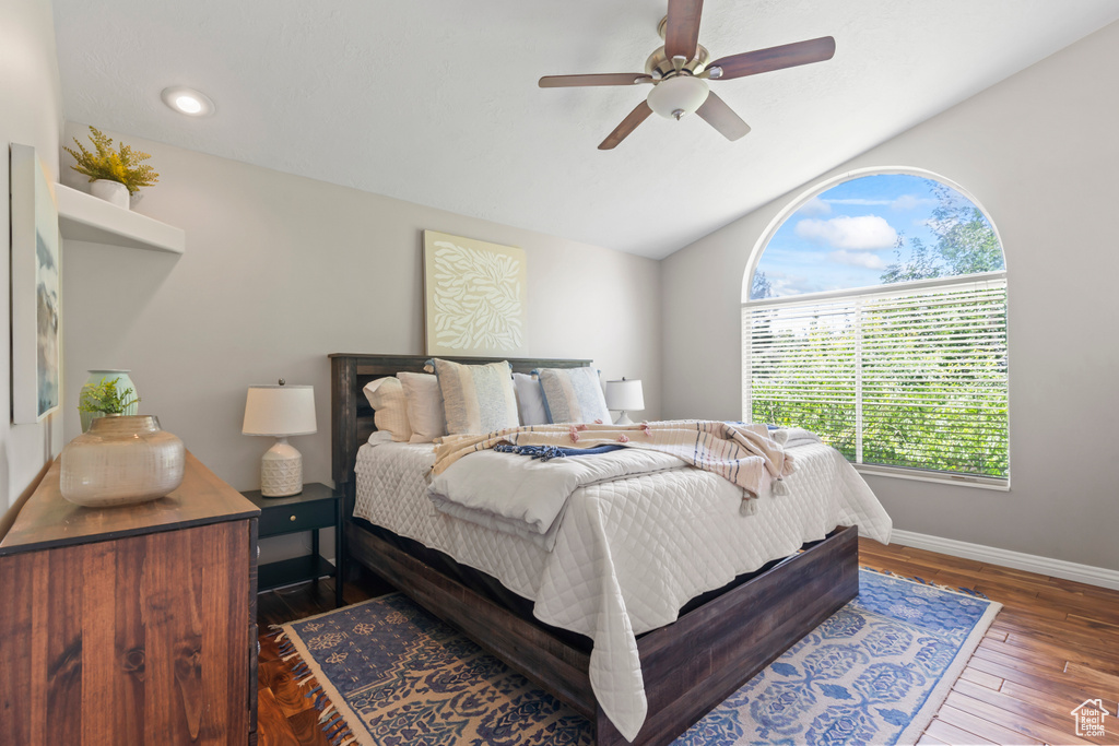 Bedroom featuring wood finished floors, vaulted ceiling, ceiling fan, and recessed lighting