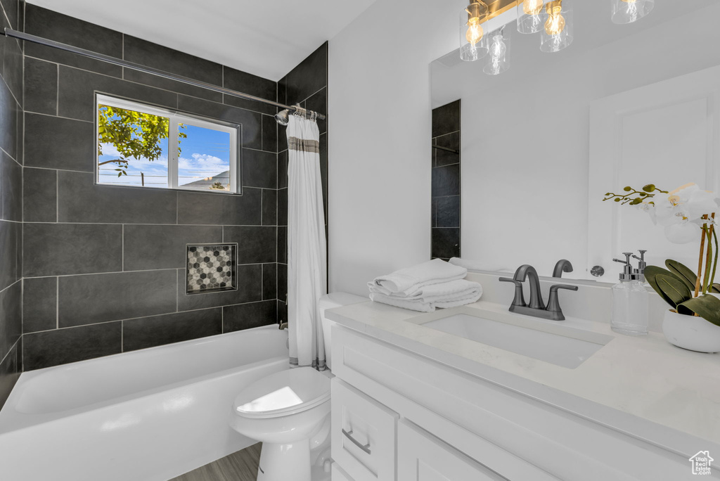 Bathroom with vanity and shower / bath combo