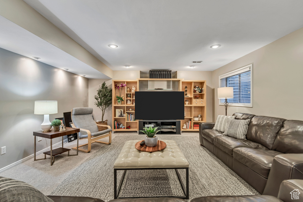 Living area featuring carpet floors and recessed lighting