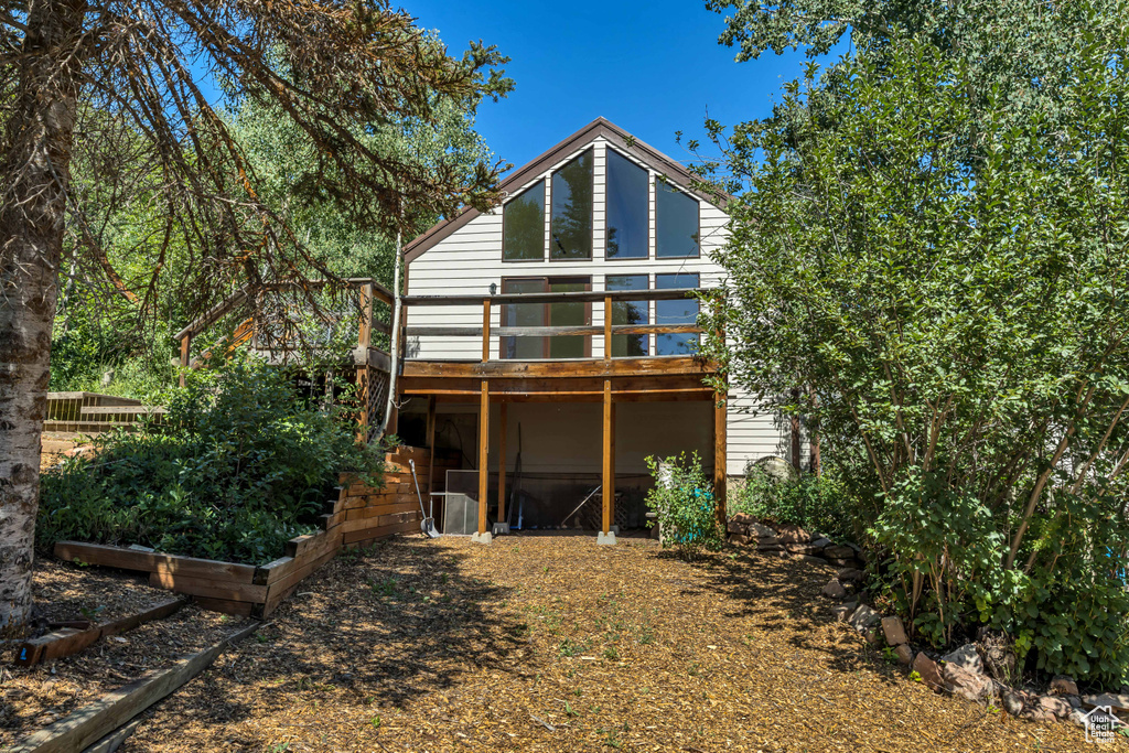 Back of house featuring a deck