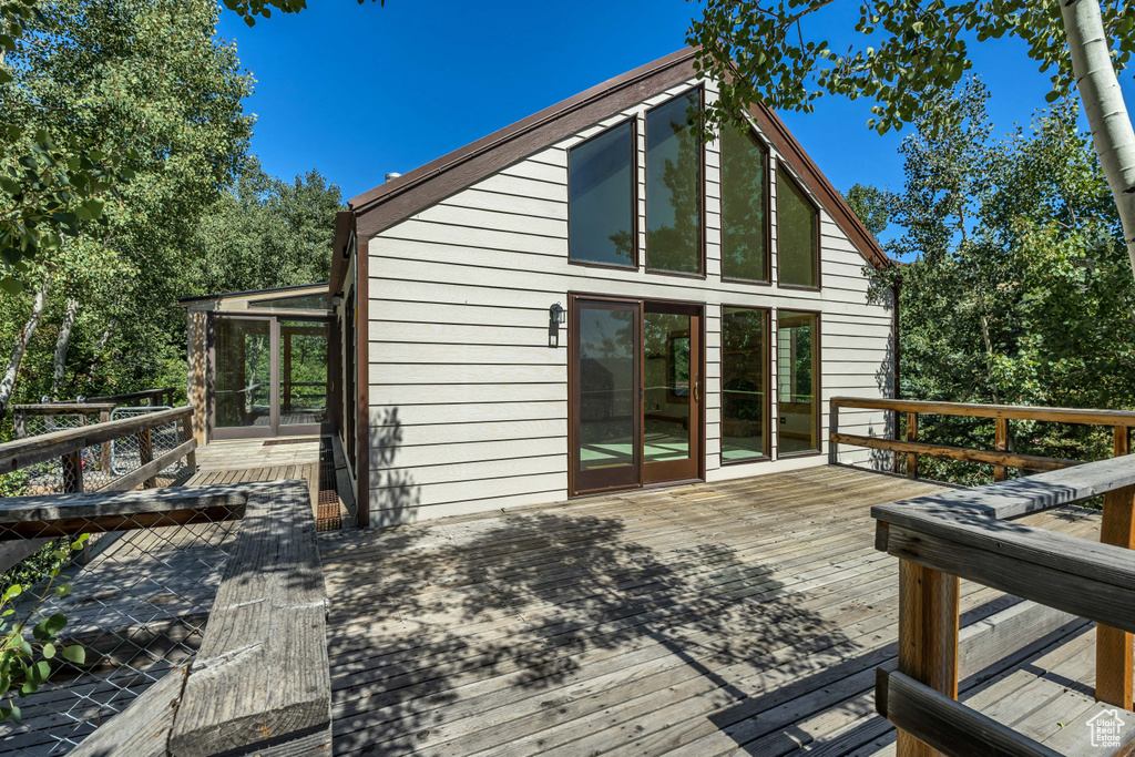 Wooden deck with a sunroom