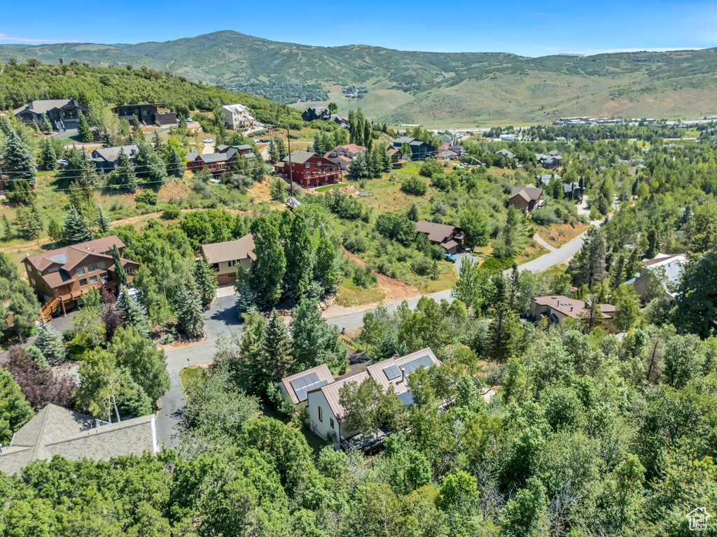 View of property location featuring a mountain backdrop and nearby suburban area