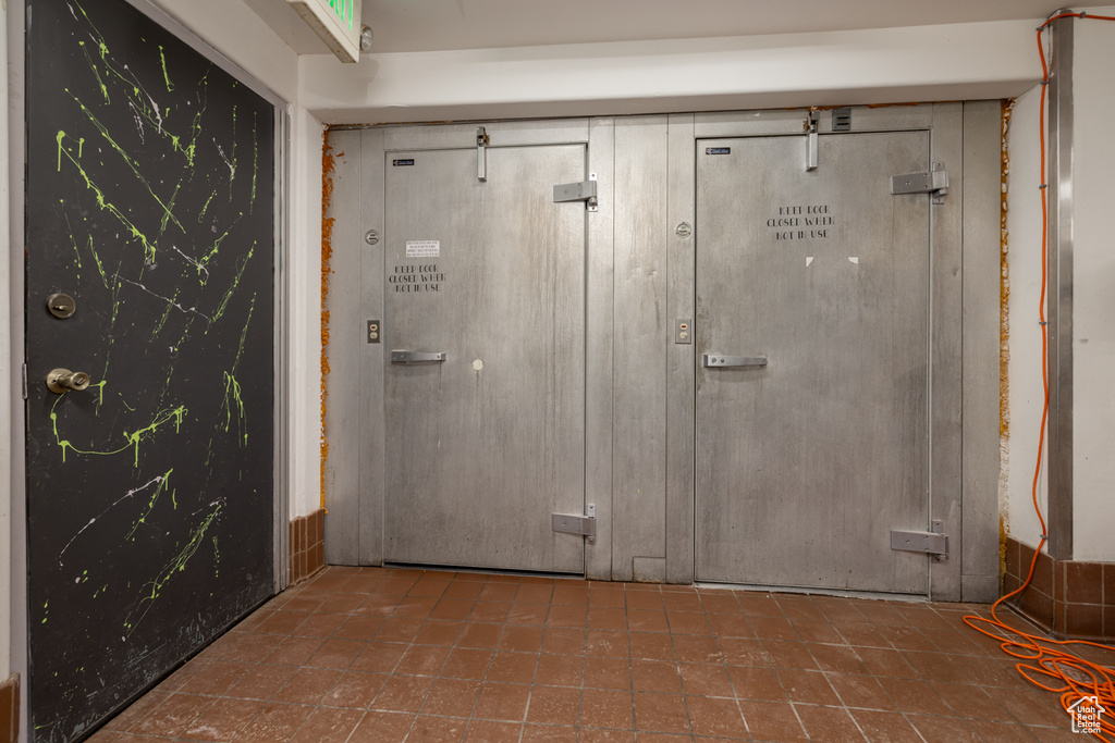 Foyer entrance featuring tile patterned flooring