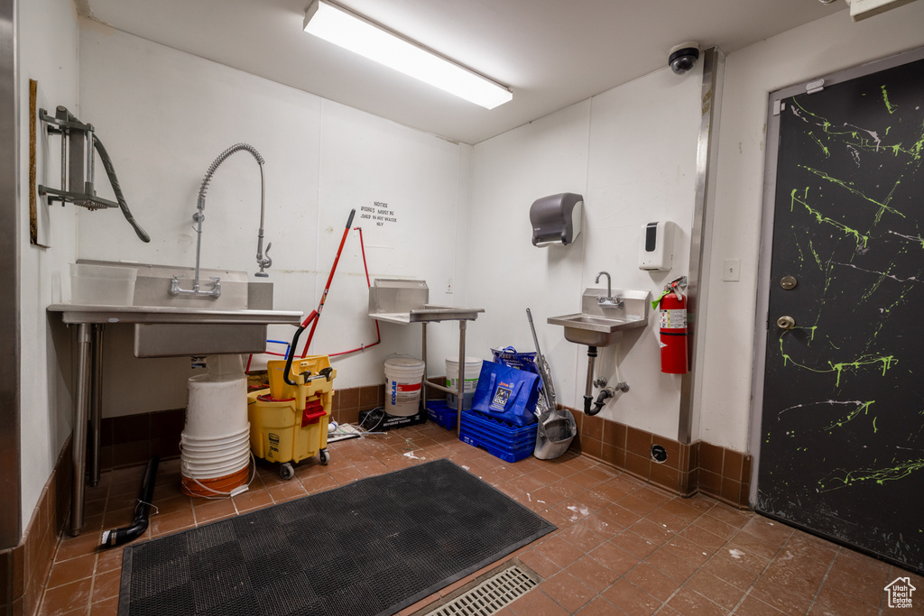 Miscellaneous room with tile patterned floors