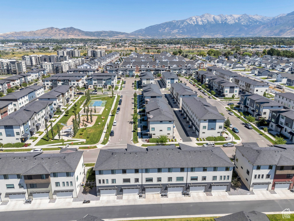 Aerial perspective of suburban area featuring a mountain backdrop