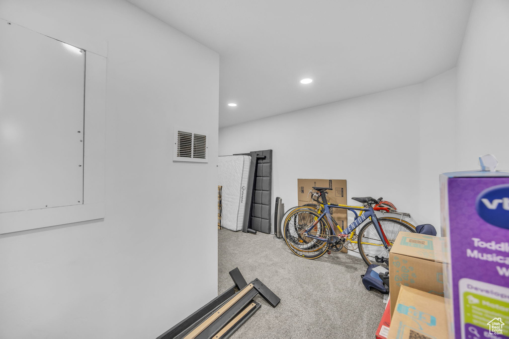 Workout room with carpet flooring and recessed lighting