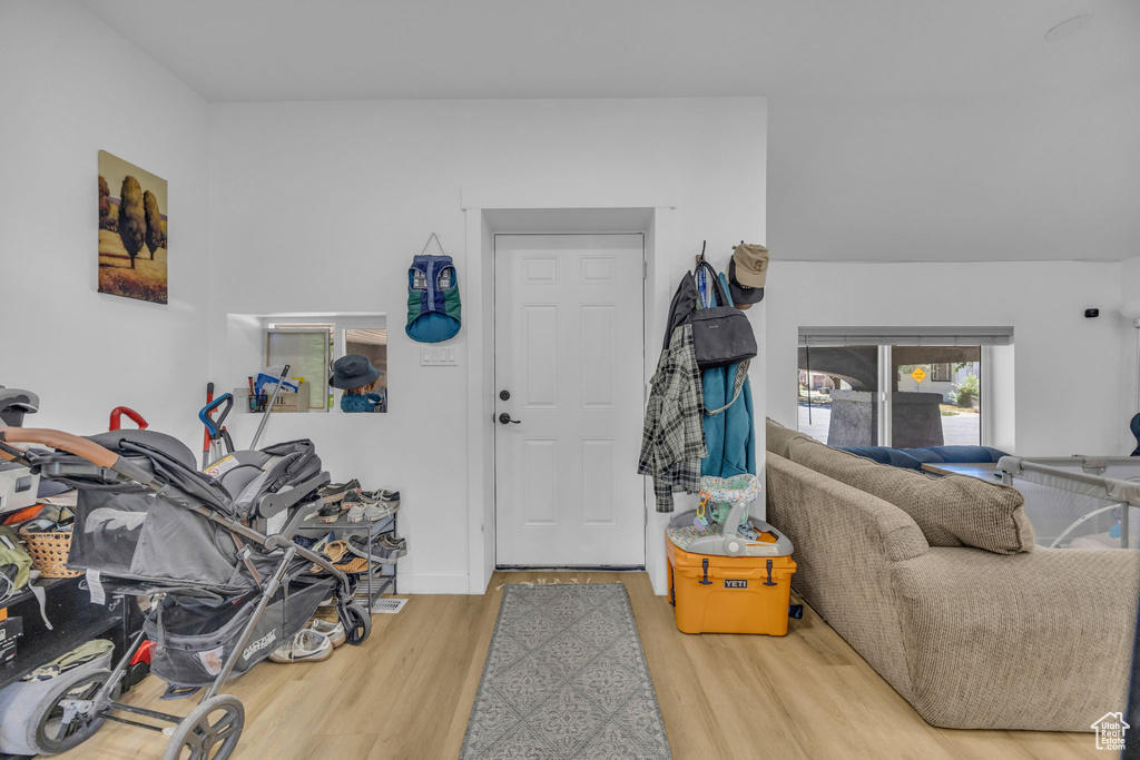 Entryway featuring wood finished floors and baseboards