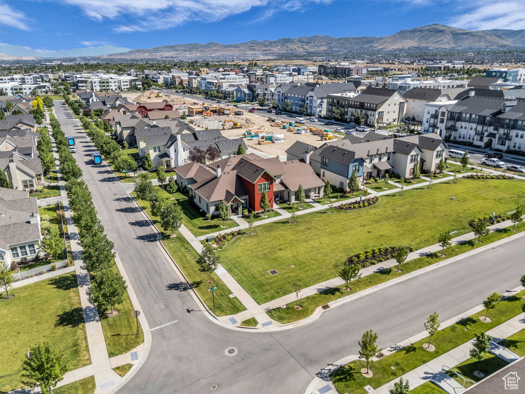 Aerial view of residential area featuring a mountainous background