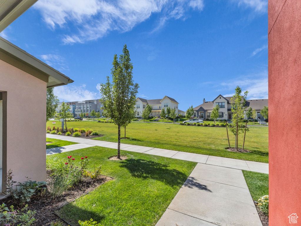 View of grassy yard with a residential view