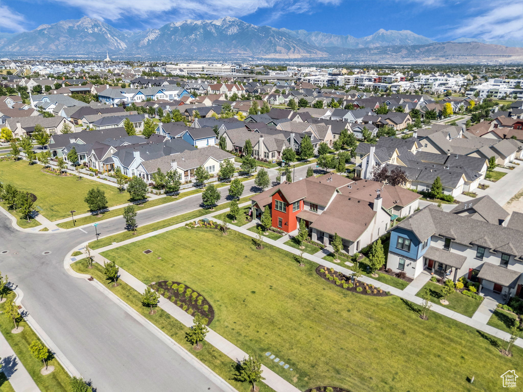 Aerial perspective of suburban area with a mountainous background